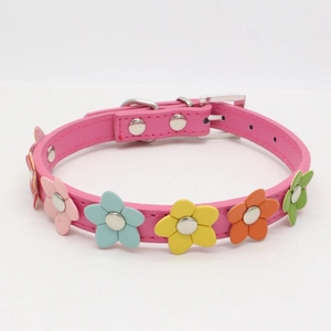 Detail of pink PU leather dog collar with colorful flowers and silver buckle clasp