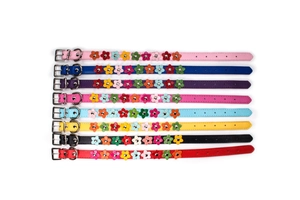 Detailed display of multiple colorful PU leather pet collars with decorative flowers.