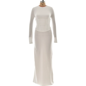 Detail of white long sleeve dress with corset waist shaping and slit cuff details