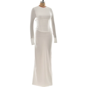 Detail of white bodycon dress featuring boned corset waist and thumbhole cuffs