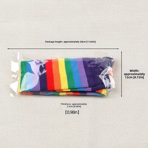 Flat lay detail of rainbow striped thigh high socks in retail packaging with measurements