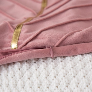 Pink velvet decorative throw pillow cover with golden trim and invisible zipper detail