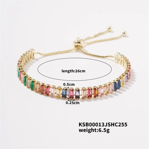 Detail of adjustable gold-plated tennis bracelet with multi-color baguette-cut zircons