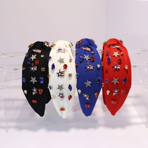 Detail view of wide-brimmed knotted headbands with American flag stars and rhinestones