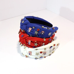 Detail of knotted headbands with rhinestones, silver stars and American flag charms