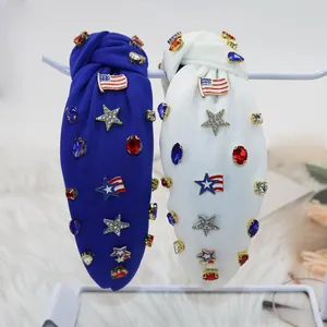 Detail of knotted headbands with American flag patches and sparkling rhinestones