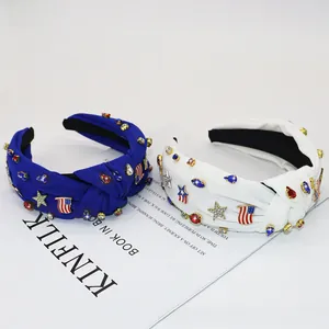 Detail of knotted headbands with American flag charms, rhinestones and golden stars