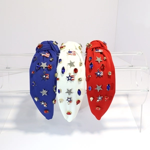 Detail of knotted headbands with American flag stars and rhinestones on acrylic stand