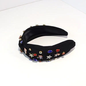 Detail of knotted headband with American flag motifs and colorful rhinestones on fabric