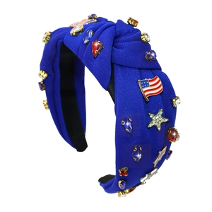 Detail of knotted blue headband with crystal stars and American flag jewelry ornaments