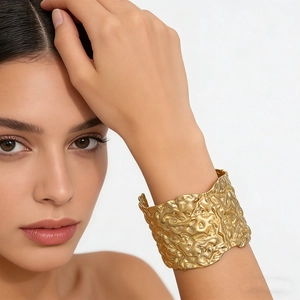 Chic geometric gold-finish cuff bracelet with textured crumpled metal design for women