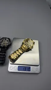 Detailed view of the automatic skeleton mechanical watch weighing 131.0g on a digital scale
