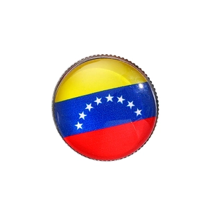 Detail of round Venezuela flag brooch with colorful stripes and metallic jagged edges