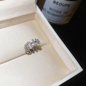Close-up view of a luxury zircon-encrusted ear cuff in a box for non-pierced ears
