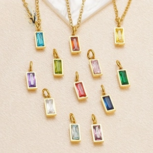 Detailed view of rectangle cut colorful zircon pendants with 18K gold plated metal bails