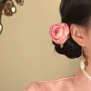 Detailed view of an elegant handmade pink rose flower hair pin accessory for hair styling
