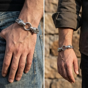 Detailed macro view of vintage wolf head steel bracelet with dual-layer woven chain link