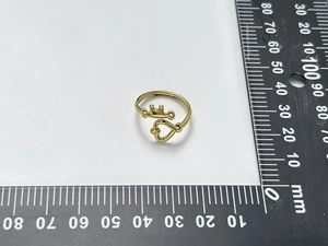 Detail view of 18K gold plated heart ring size measurement with a professional ruler