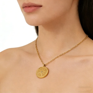 Eight-pointed star coin necklace in gold finish with a sparkling center zircon stone