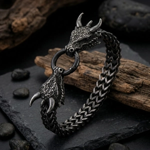 Close-up of vintage punk dragon head bracelet with detailed scales and silver finish