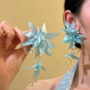 Light blue oversized fabric flower drop earrings with pearls and crystal tassels