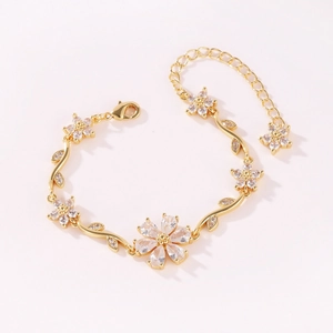 Elegant gold flower bracelet with sparkling crystal petals and adjustable lobster clasp