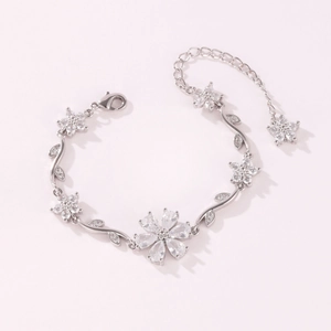 Close-up of silver-tone flower bracelet with marquise-cut crystals and lobster clasp