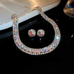 Detailed view of vintage royal style necklace and earring set with iridescent crystals