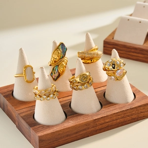 Detailed collection of gold stainless steel rings with colorful zircon and cat's eye stones