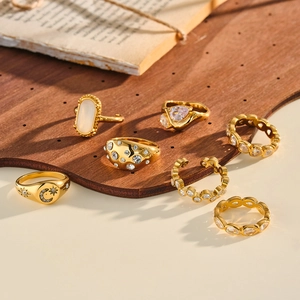 A set of elegant gold stainless steel rings with sparkling zircon and cat eye stones