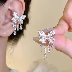 Detailed view of silver butterfly tassel ear cuff with crystals for non-pierced ears