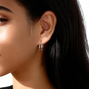 Close-up of minimalist S925 sterling silver double-layer U-shaped hoop earrings