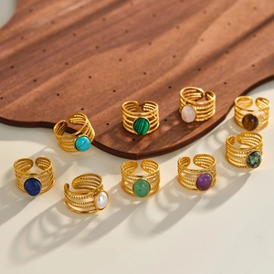 Collection of vintage 18k gold plated stainless steel rings with natural stones