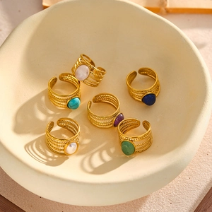 Close-up of vintage 18k gold-plated stainless steel rings set with natural gemstones.