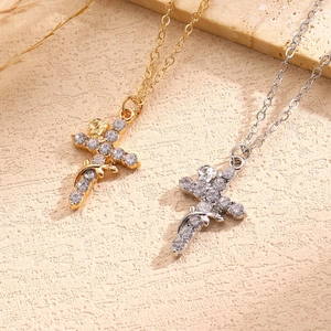 Detail view of luxurious gold and silver cross pendants with shimmering cubic zirconia