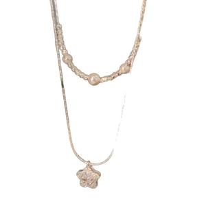 Elegant double-layer gold-tone necklace featuring pearls and a zircon star pendant