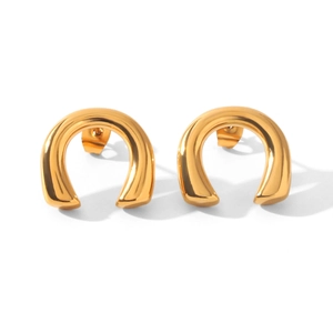 Detailed close-up view of minimalist gold U-shaped stud earrings in polished titanium steel