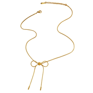 Detail of gold bow necklace featuring sleek snake chain and S-STEEL metal tag
