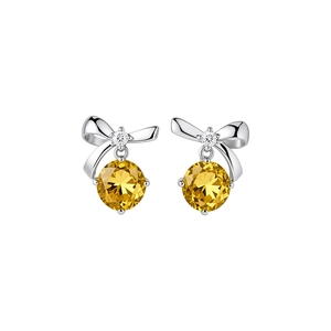Eleganti orecchini a lobo a fiocco in argento con pendenti in zircone giallo brillante
