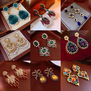 Collection of nine vintage bohemian floral earrings in gold alloy with colorful resin