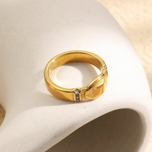 Close-up of 18K gold-plated stainless steel ring with oval detail and rhinestones