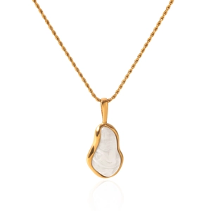 Close-up of golden necklace with irregular white faux Baroque pearl pendant