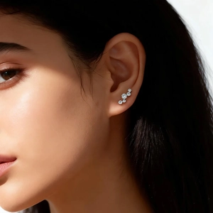 Close-up of S925 silver bubble crawler earrings with five sparkling cubic zirconia stones