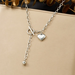 Silver-toned Y-shaped stainless steel necklace with OT toggle clasp and heart charm