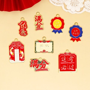 Detailed view of alloy charms featuring graduation and success themed Chinese calligraphy.