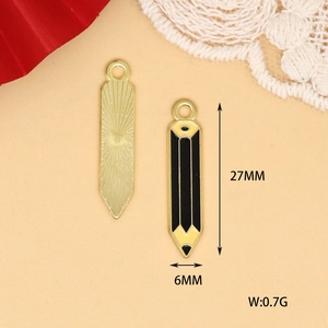 Macro detail view of pencil-shaped enamel charm showing 27x6mm dimensions and weight