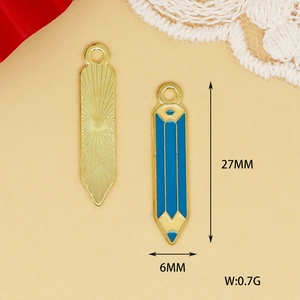 Detailed view of gold and blue pencil enamel charms with size measurements