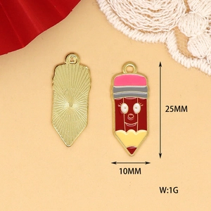Macro view of cute enamel pencil alloy pendants showing front design and back metal texture