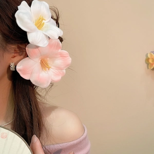 Elegant white and pink mesh flower hair clips worn by a model in a sweet fashion style