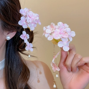 Detailed view of pink mesh fabric flower hair clips with elegant pearl tassels